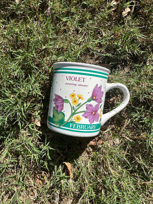 February Flower Meaning Coffee Mug